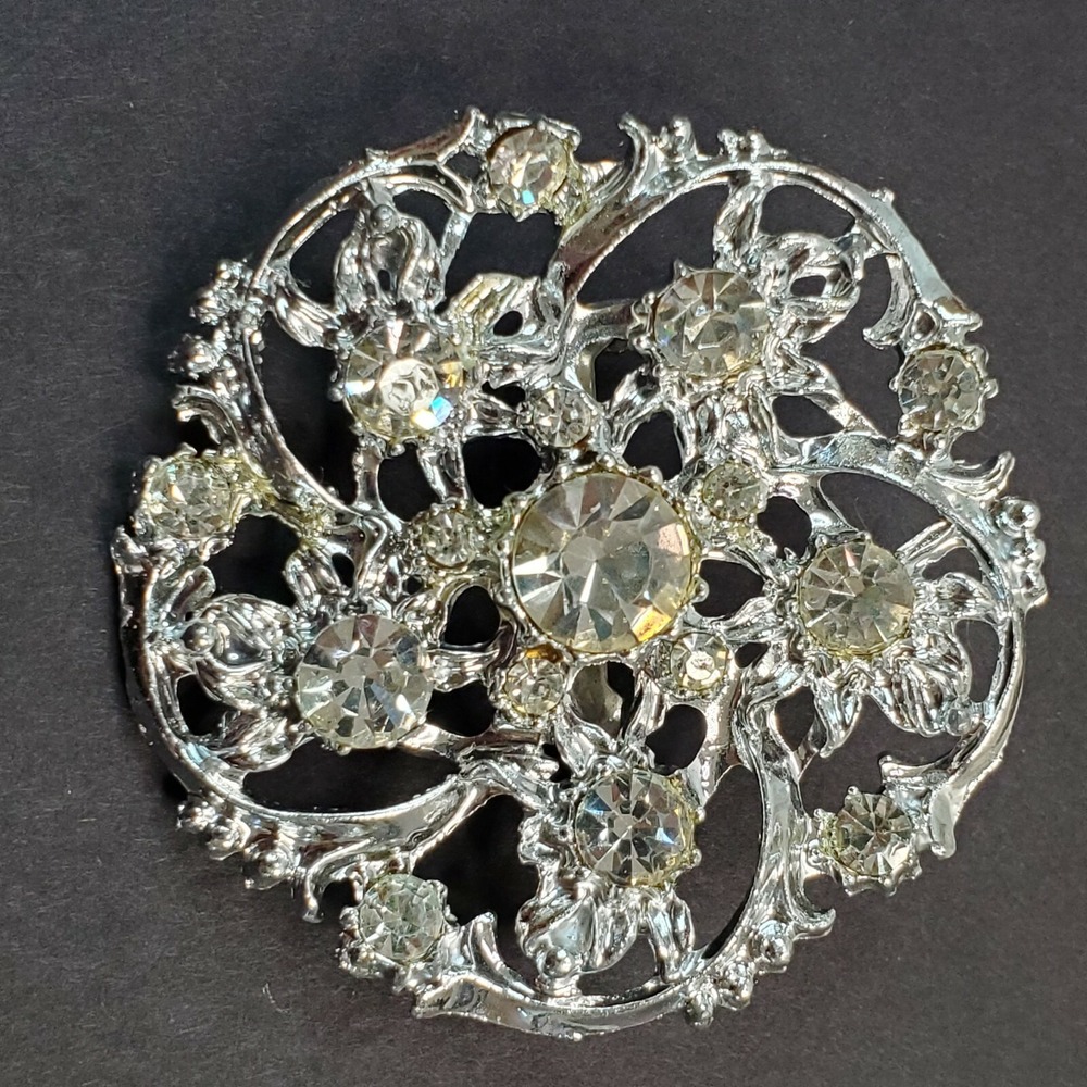 Vintage Silver Tone Clear Rhinestone Round Swirl Snowflake Open Work Pin Brooch